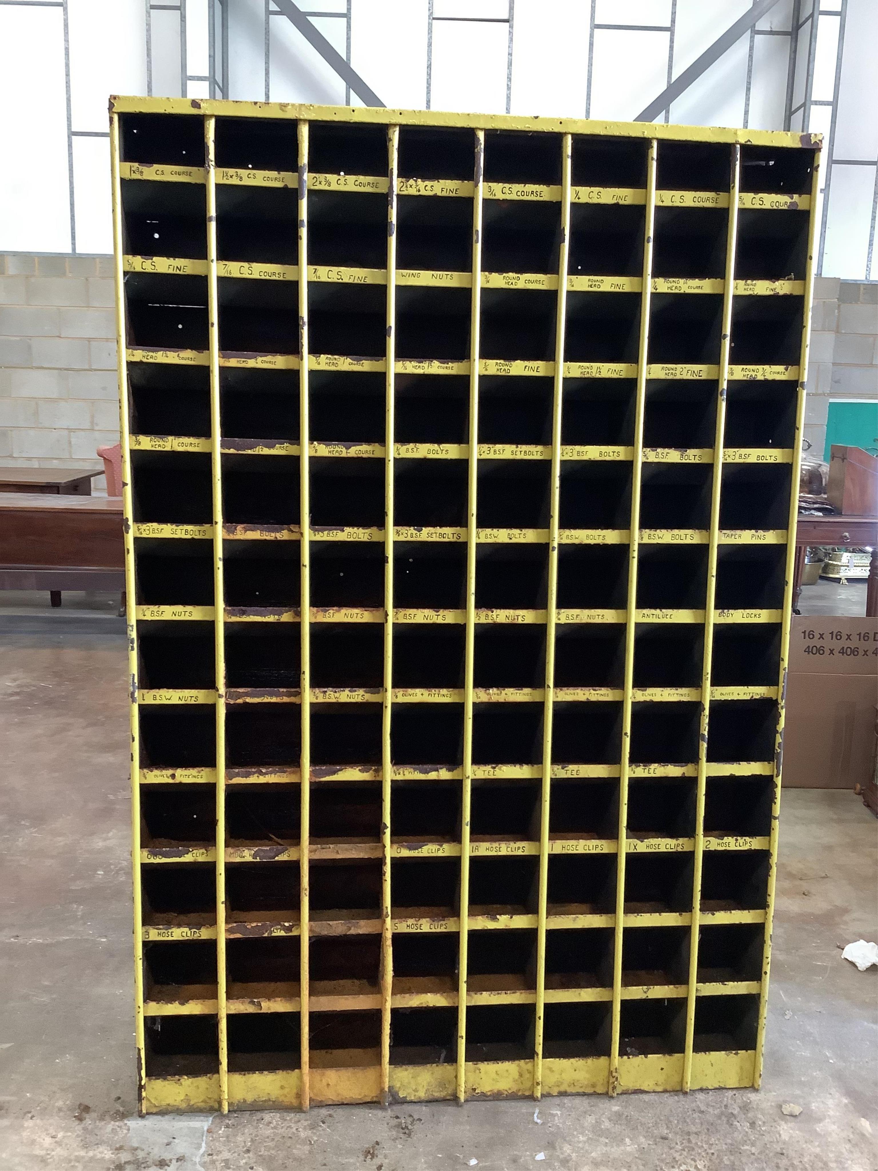 An industrial steel pigeonhole unit, width 122cm, depth 23cm, height 183cm. Condition - poor